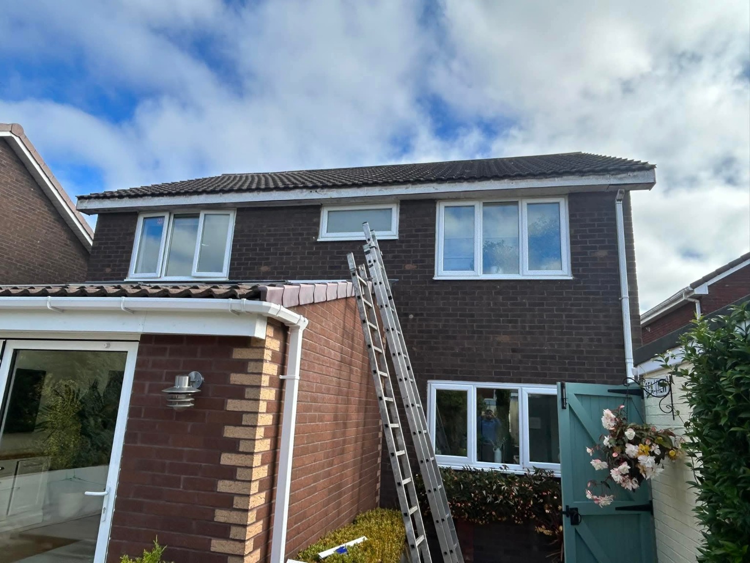 Tiled roof on two-storey brick home