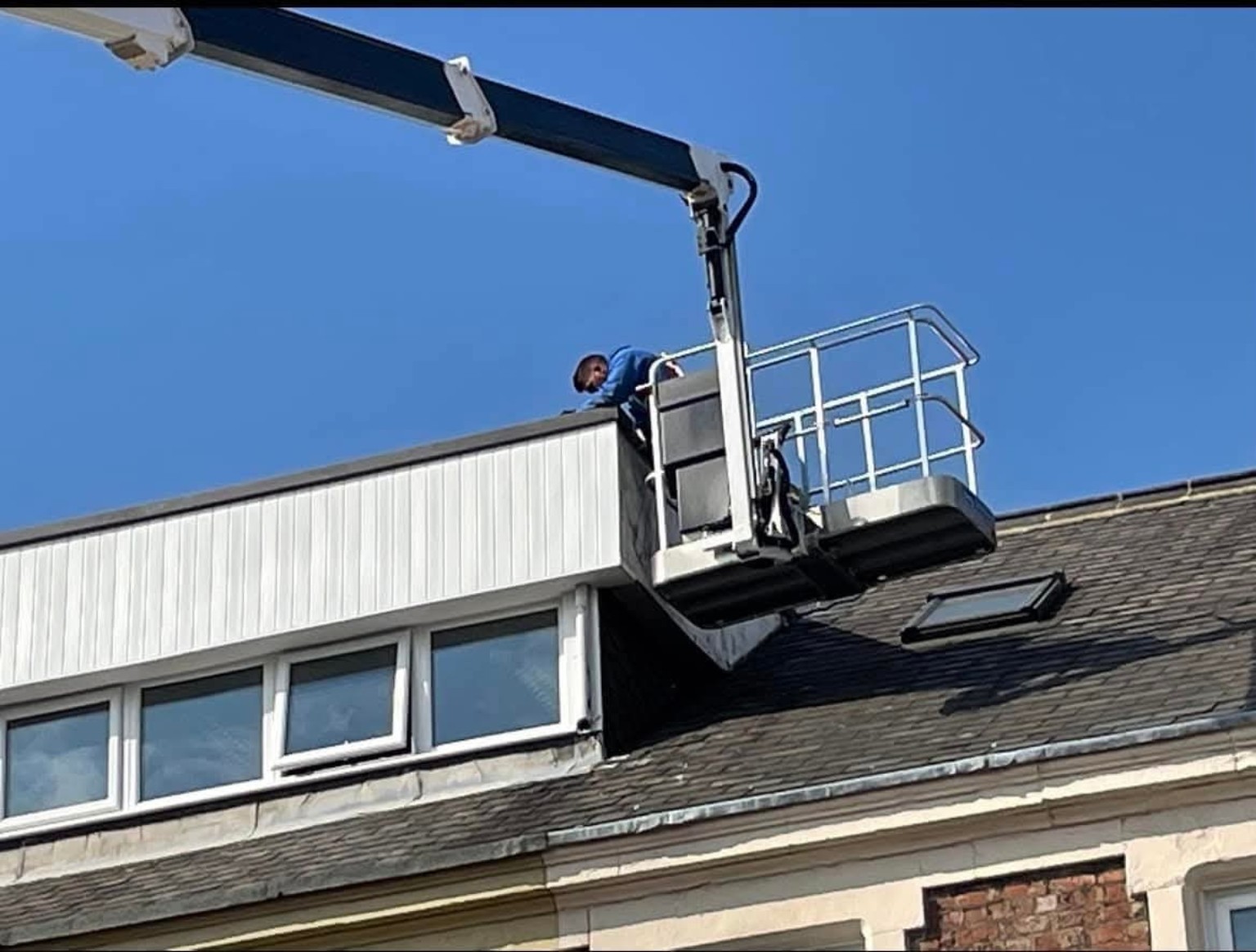 Roofing work carried out using an elevated platform